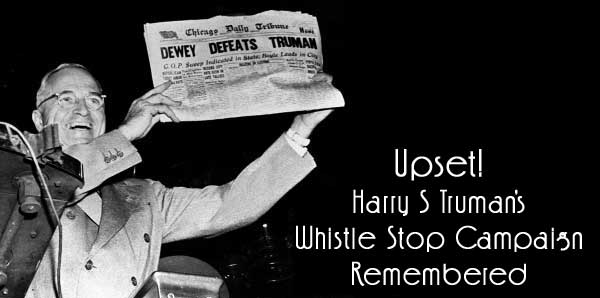 photo of Truman holding newspaper with "Dewey Defeats Truman" headline