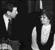 Governor John Ashcroft and Carolyn Leuthold of the League of Women Voters meet to discuss ethics reform in Missouri. Missouri State Archives, Associated Press Collection